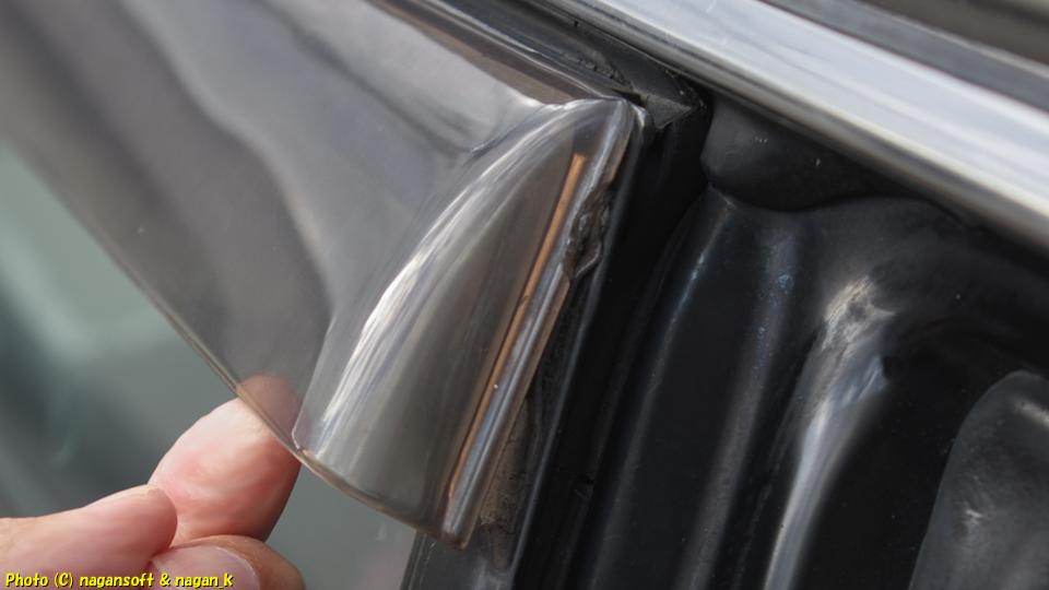 The visor on the right rear door of the CrownWagon is detached.
