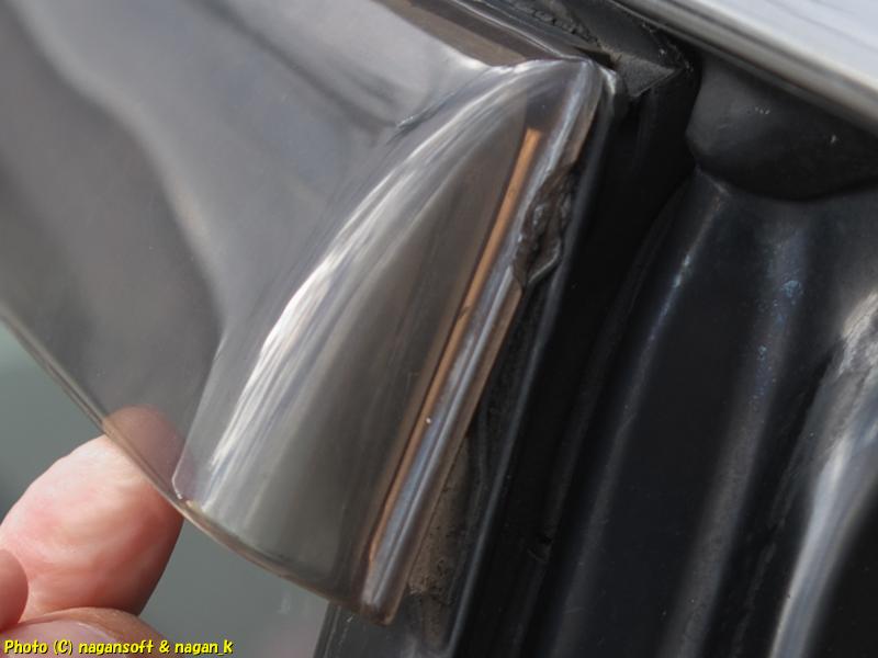 The visor on the right rear door of the CrownWagon is detached.