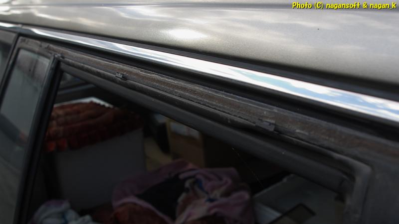 Removed the visor from the right rear door of the CrownWagon. The retaining clips and the double-sided tape, worn out from age, remain.